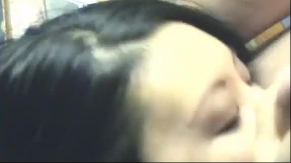 Brunette asian sucking on the fat dick of her man